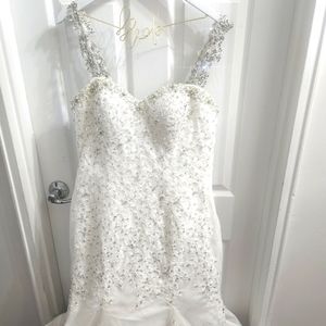Wedding dress, with real crystals on dress, bustled back, removable straps